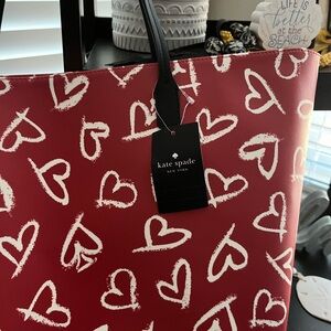 Brand New Kate Spade bag. Never used. Big bag. Color is red with white hearts.